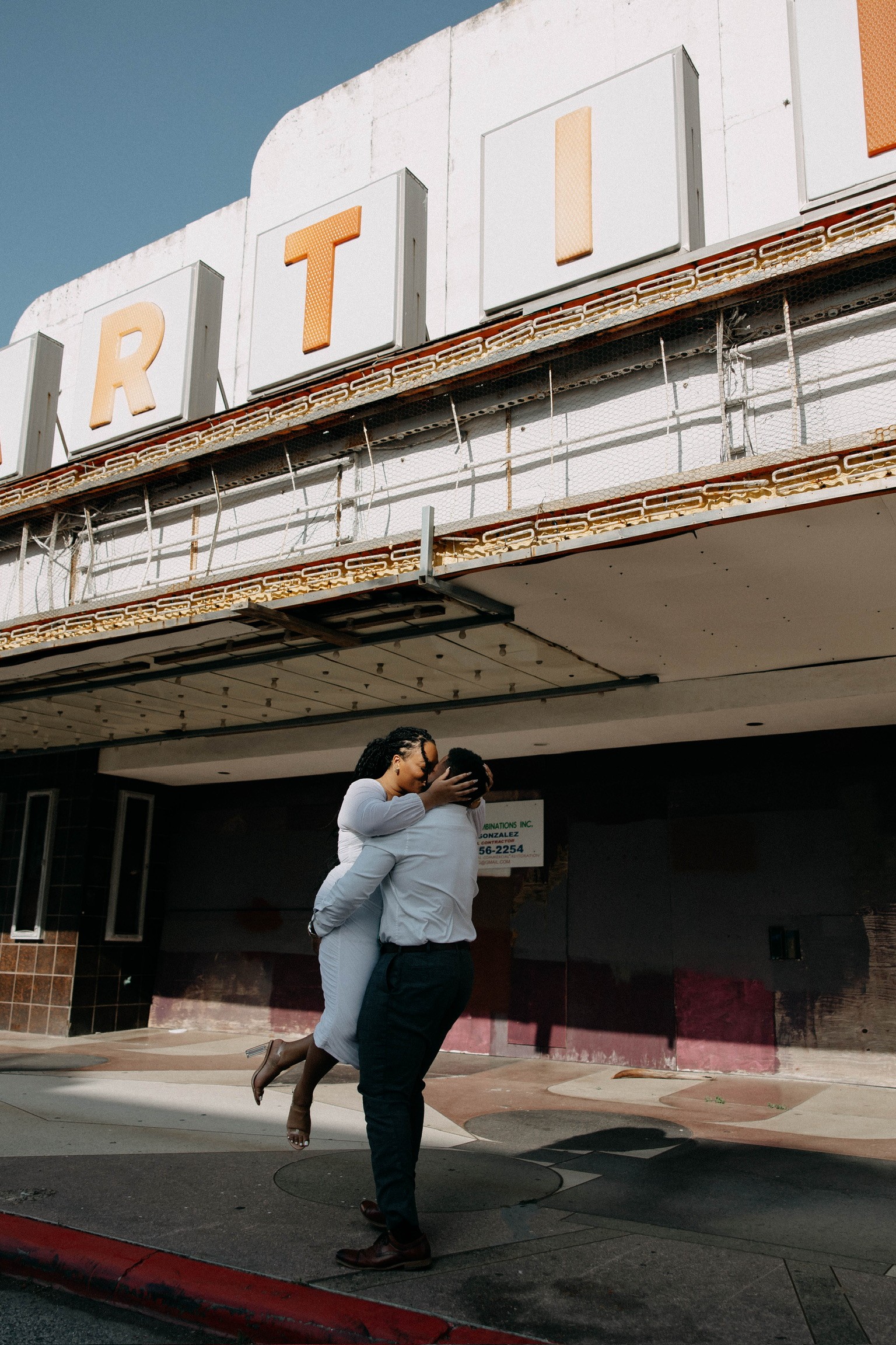 Tiffani and Leonard embracing